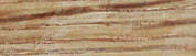 Close-up horizontal texture of light brown polished travertine stone with natural vein patterns.