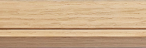 Close-up of light brown composite decking board with wood grain texture